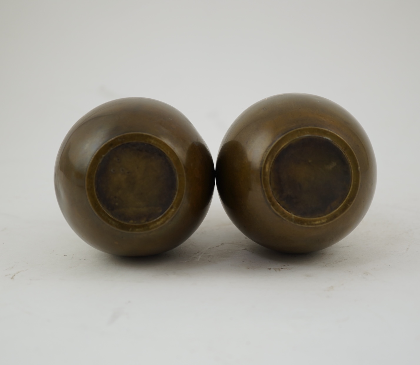 A pair of Japanese bronze and mixed metal inlaid bottle vases, signed Hidemitsu, Meiji period